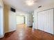 Bright bedroom with tile flooring, double closets and a flat screen tv at 2439 Madrid Ave, Safety Harbor, FL 34695