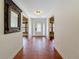 Inviting foyer with tiled floor and decorative glass front door, leading to bright living spaces at 2439 Madrid Ave, Safety Harbor, FL 34695