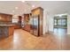 Spacious kitchen featuring wood cabinets, stainless steel appliances, and an island with stone accents at 2439 Madrid Ave, Safety Harbor, FL 34695