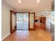 Open floor plan that overlooks the lanai, including the wood deck, pool, and living room with a fireplace at 2439 Madrid Ave, Safety Harbor, FL 34695