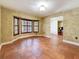 Stylish living room featuring tiled floors, shuttered bay windows and decorative, textured walls at 2439 Madrid Ave, Safety Harbor, FL 34695
