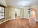 Cozy living room featuring tiled floors, textured walls, and a large window with shuttered blinds at 2439 Madrid Ave, Safety Harbor, FL 34695