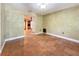 Inviting living room with tiled floor, neutral wall color and doorway to other rooms in home at 2439 Madrid Ave, Safety Harbor, FL 34695