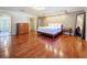 Spacious main bedroom featuring hardwood floors, recessed lighting and ensuite bathroom at 2439 Madrid Ave, Safety Harbor, FL 34695