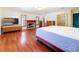 Bright main bedroom with a fireplace, hardwood floors, and walk-in closet at 2439 Madrid Ave, Safety Harbor, FL 34695