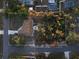 Aerial view of residential property with large trees and long driveway amidst a verdant suburban landscape at 270 Planter Rd, Spring Hill, FL 34606