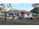 Large backyard with a gazebo, play structure, and open grass, perfect for outdoor fun and entertaining at 270 Planter Rd, Spring Hill, FL 34606
