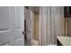 Bathroom with tub and shower featuring neutral toned shower curtain and decorative towels at 270 Planter Rd, Spring Hill, FL 34606