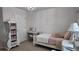 Decorated bedroom with daybed, chandelier, wardrobe, and desk at 270 Planter Rd, Spring Hill, FL 34606