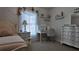 Bedroom with chandelier, desk, and decorated walls at 270 Planter Rd, Spring Hill, FL 34606