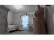 Decorated bedroom featuring a chandelier, canopy bed, desk, and window at 270 Planter Rd, Spring Hill, FL 34606