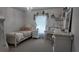 Decorated bedroom with daybed, chandelier, desk, and decorated walls at 270 Planter Rd, Spring Hill, FL 34606