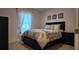 Bedroom with patterned bedding, decorative headboard, and matching nightstand at 270 Planter Rd, Spring Hill, FL 34606
