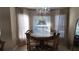 Elegant dining area with a chandelier and sheer curtains providing soft, natural light at 270 Planter Rd, Spring Hill, FL 34606