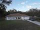 Charming single-story home with a two-car garage and a well-manicured lawn in a tranquil neighborhood at 270 Planter Rd, Spring Hill, FL 34606