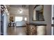 The foyer with ornate dresser leads to a living space with light tile flooring at 270 Planter Rd, Spring Hill, FL 34606
