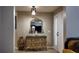 View of the foyer featuring an ornate dresser with a mirror and light fixture at 270 Planter Rd, Spring Hill, FL 34606