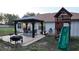 Backyard gazebo features a table, chairs, and string lights, perfect for outdoor entertaining and relaxation at 270 Planter Rd, Spring Hill, FL 34606