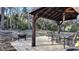 Gazebo featuring a ceiling fan and table/chairs offer a relaxing outdoor space for dining and relaxation at 270 Planter Rd, Spring Hill, FL 34606