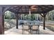 Outdoor dining and grill under backyard gazebo at 270 Planter Rd, Spring Hill, FL 34606