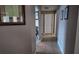 Hallway has neutral paint and tile flooring with access to various rooms in the home at 270 Planter Rd, Spring Hill, FL 34606