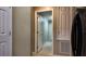 Inviting hallway features neutral paint, white doors, and tiled flooring that create an airy and spacious feel at 270 Planter Rd, Spring Hill, FL 34606