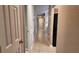 Hallway features neutral paint and tile flooring with access to multiple rooms at 270 Planter Rd, Spring Hill, FL 34606