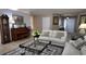 Cozy living room featuring a piano, grandfather clock, and stylish furnishings at 270 Planter Rd, Spring Hill, FL 34606