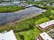 Aerial view of marina with waterfront condos, lush greenery, and serene water views at 2700 Bayshore Blvd # 544, Dunedin, FL 34698