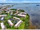 Breathtaking aerial view of waterfront condos with lush landscaping and stunning bay views at 2700 Bayshore Blvd # 544, Dunedin, FL 34698
