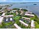 Waterfront condo community with access to tennis courts, a pond, assigned parking, and mature trees at 2700 Bayshore Blvd # 544, Dunedin, FL 34698