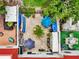 Aerial view of the brick patio featuring outdoor seating, lush plants and watercraft storage at 2700 Bayshore Blvd # 544, Dunedin, FL 34698