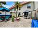 Spacious brick patio featuring two seating areas, a grill, and lots of plants and flowers at 2700 Bayshore Blvd # 544, Dunedin, FL 34698