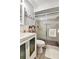 Modern bathroom with a white vanity, sliding glass shower doors, and neutral flooring at 2700 Bayshore Blvd # 544, Dunedin, FL 34698