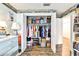 Bedroom closet with organized storage, including clothing racks, shelves, and overhead compartments at 2700 Bayshore Blvd # 544, Dunedin, FL 34698