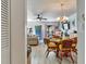 Cozy dining area with a charming chandelier, comfortable seating, and seamless flow to the living room at 2700 Bayshore Blvd # 544, Dunedin, FL 34698