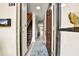 Inviting entryway with wood-look floors, stairs to the second floor and a view to the lanai at 2700 Bayshore Blvd # 544, Dunedin, FL 34698