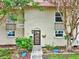 Charming townhouse featuring a well-manicured lawn, mature trees and colorful flowering shrubs at 2700 Bayshore Blvd # 544, Dunedin, FL 34698