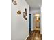 Hallway with coastal decor leading to a bathroom featuring a vanity and decorative lighting at 2700 Bayshore Blvd # 544, Dunedin, FL 34698