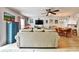 Open-concept living area featuring a comfortable sofa, dining table, and seamless flow to the kitchen at 2700 Bayshore Blvd # 544, Dunedin, FL 34698