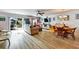 Inviting living room with comfortable furniture and access to outdoor patio space at 2700 Bayshore Blvd # 544, Dunedin, FL 34698