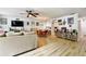 Spacious living area with a comfortable sofa, dining table, and entertainment center, ideal for gatherings at 2700 Bayshore Blvd # 544, Dunedin, FL 34698