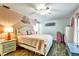 Spacious main bedroom with a ceiling fan, nice flooring and comfortable decor at 2700 Bayshore Blvd # 544, Dunedin, FL 34698