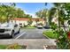 View of the community parking lot, with well-maintained landscaping and multiple parking spaces at 2700 Bayshore Blvd # 544, Dunedin, FL 34698