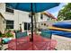 Charming outdoor patio featuring a dining set, vibrant plants, and kayaks, perfect for outdoor entertaining at 2700 Bayshore Blvd # 544, Dunedin, FL 34698