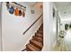 Staircase with wood-look steps and a decorative 