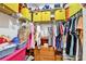Walk-in closet with shelving and hanging storage for clothing and accessories at 2700 Bayshore Blvd # 544, Dunedin, FL 34698