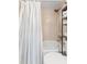 Bathroom features a shower and tub combination and built in shelves for storage at 2809 W Platt St # 6, Tampa, FL 33609