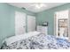 Cozy bedroom features light blue walls, ceiling fan, and ensuite bathroom at 2809 W Platt St # 6, Tampa, FL 33609