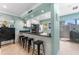 Stylish kitchen with dark granite countertops, stainless steel appliances, and bar seating at 2809 W Platt St # 6, Tampa, FL 33609